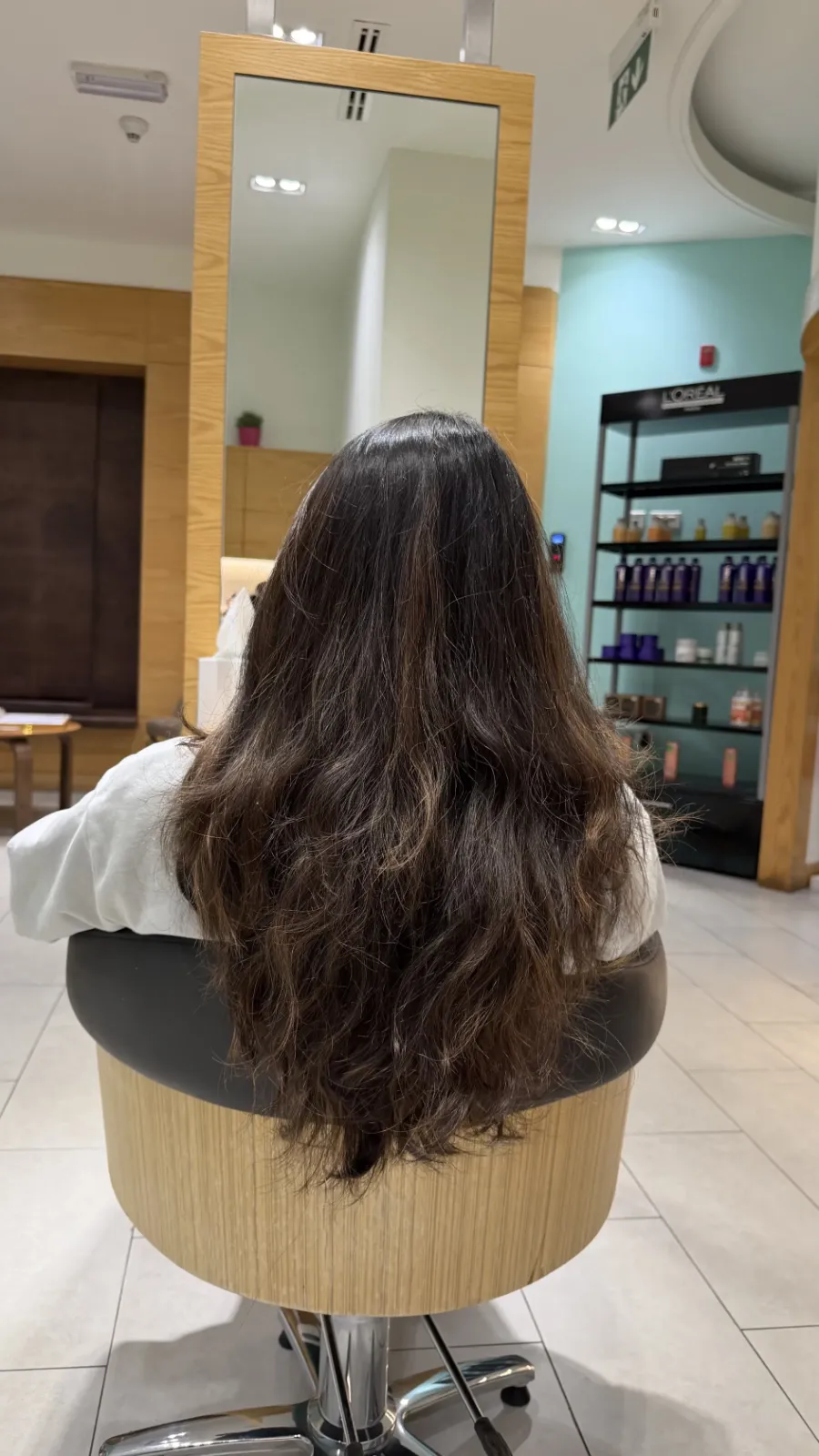 Client's dry, wavy hair before a Moremo hair treatment at Mimosa Beauty Lounge