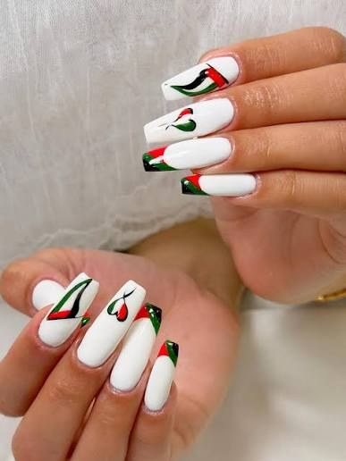 Long white nail extensions with UAE flag nail art